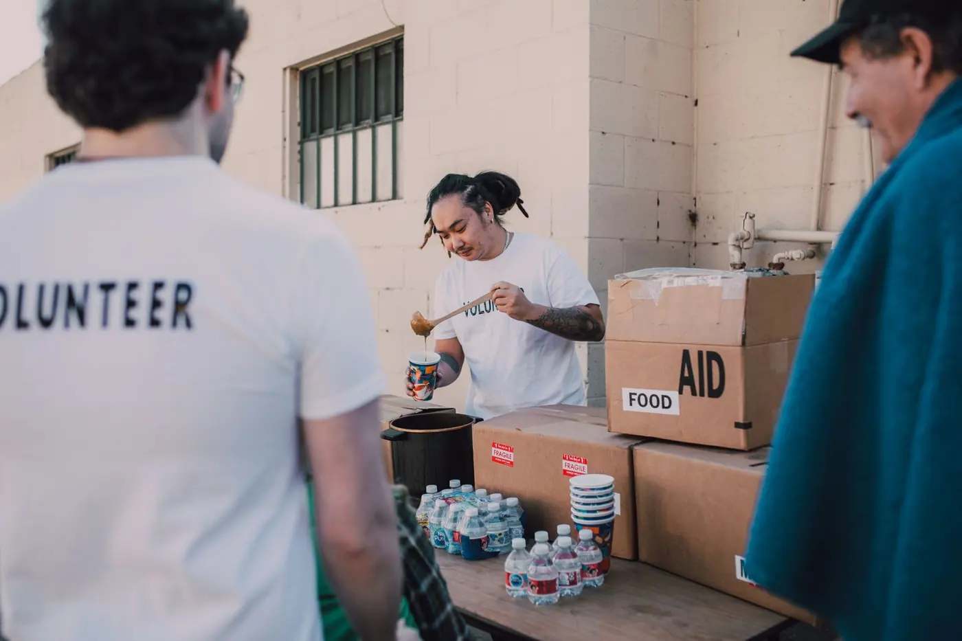 Volunteers preparing food relief parcels for their community