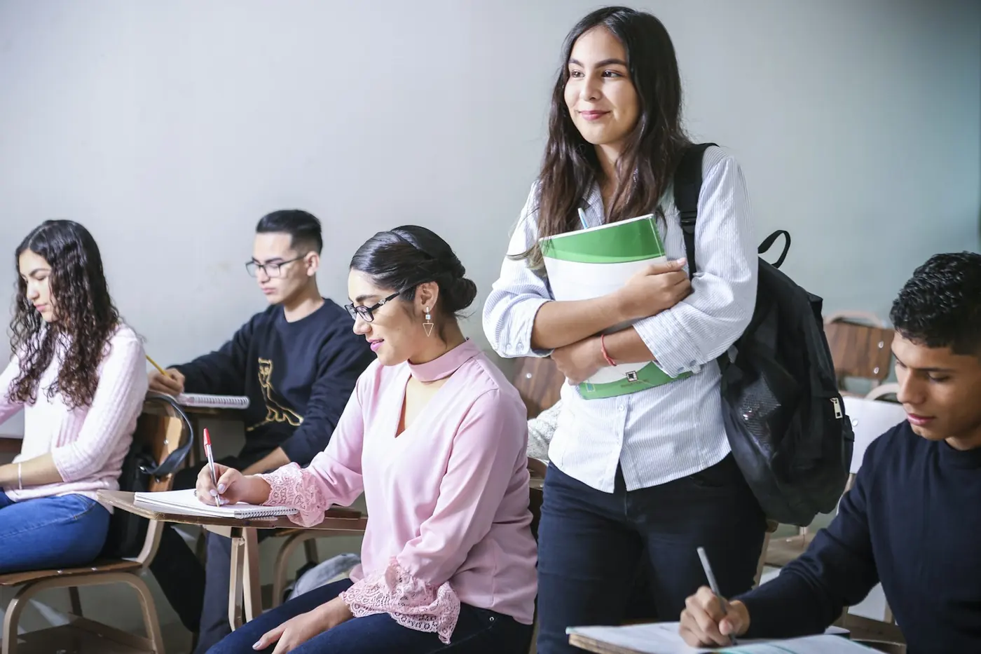 A mentor guiding a young student's learning