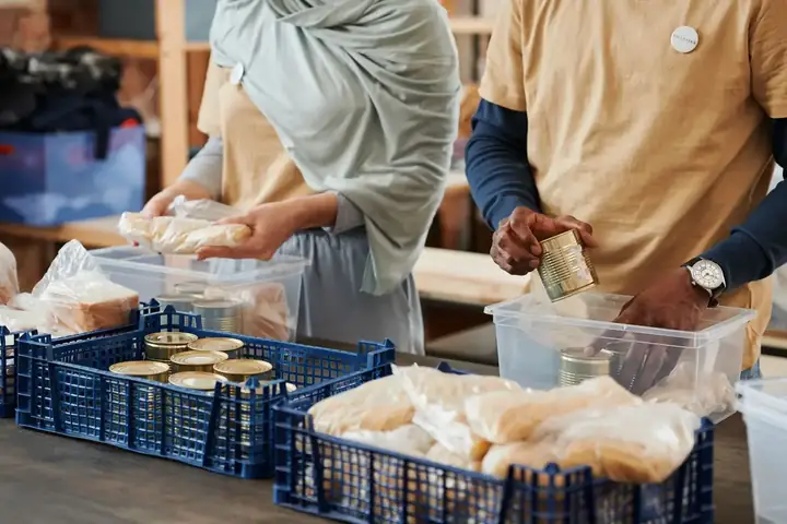 Volunteers preparing donations for distribution to families